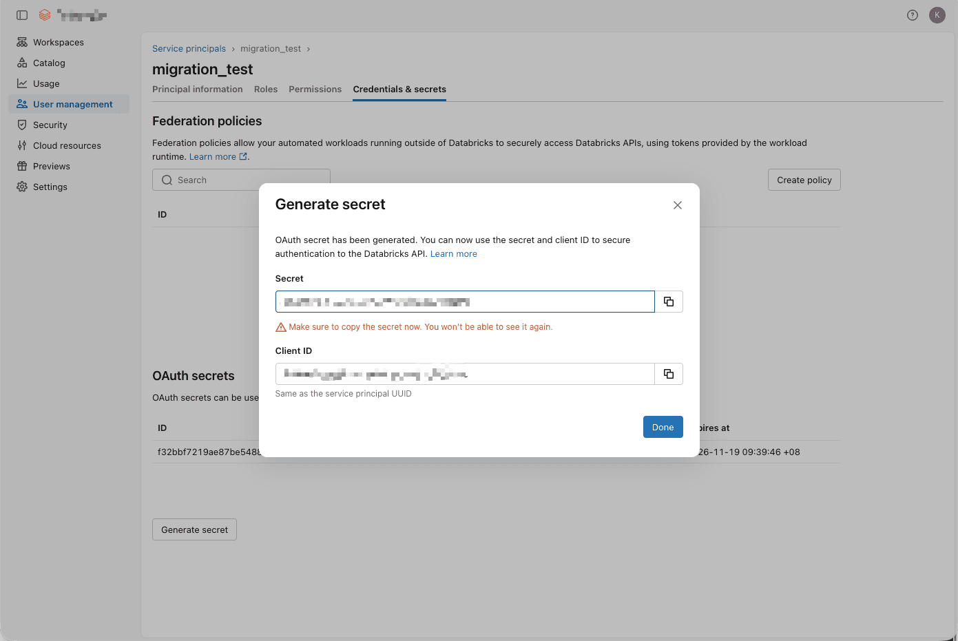 Databricks Generate secret dialog showing the one-time OAuth secret and the service principal client ID